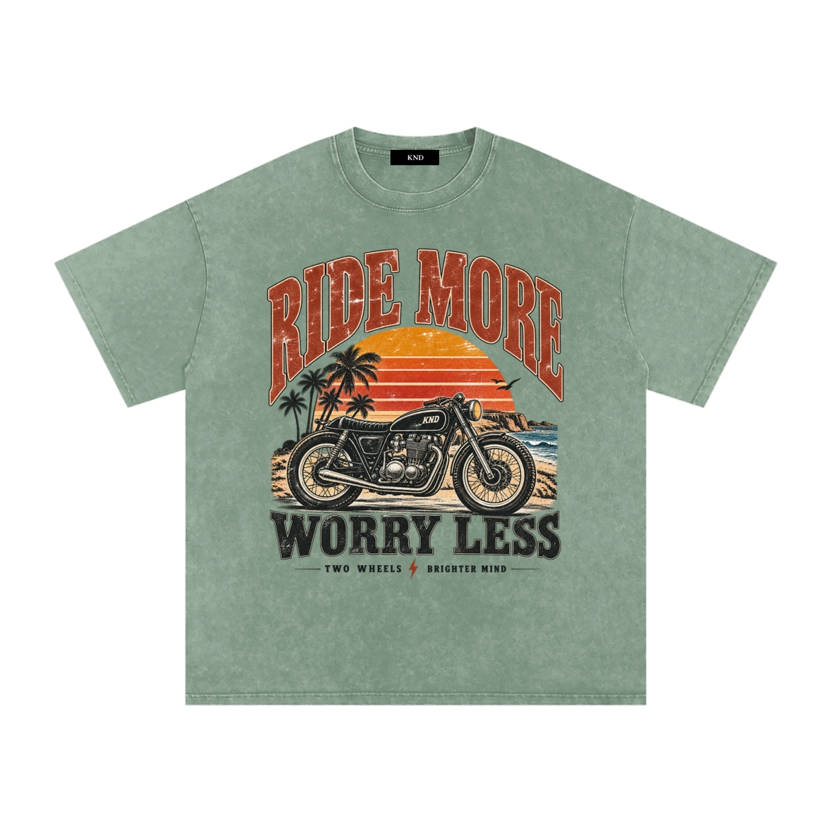 Ride More Worry Less Washed Tee, Bean Green — front print, café-racer motorcycle and coastal sunset graphic