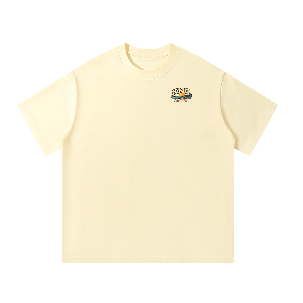 Take the Long Way Tee, Apricot — front view with the small KND coast-road-and-sunset mark on the left chest