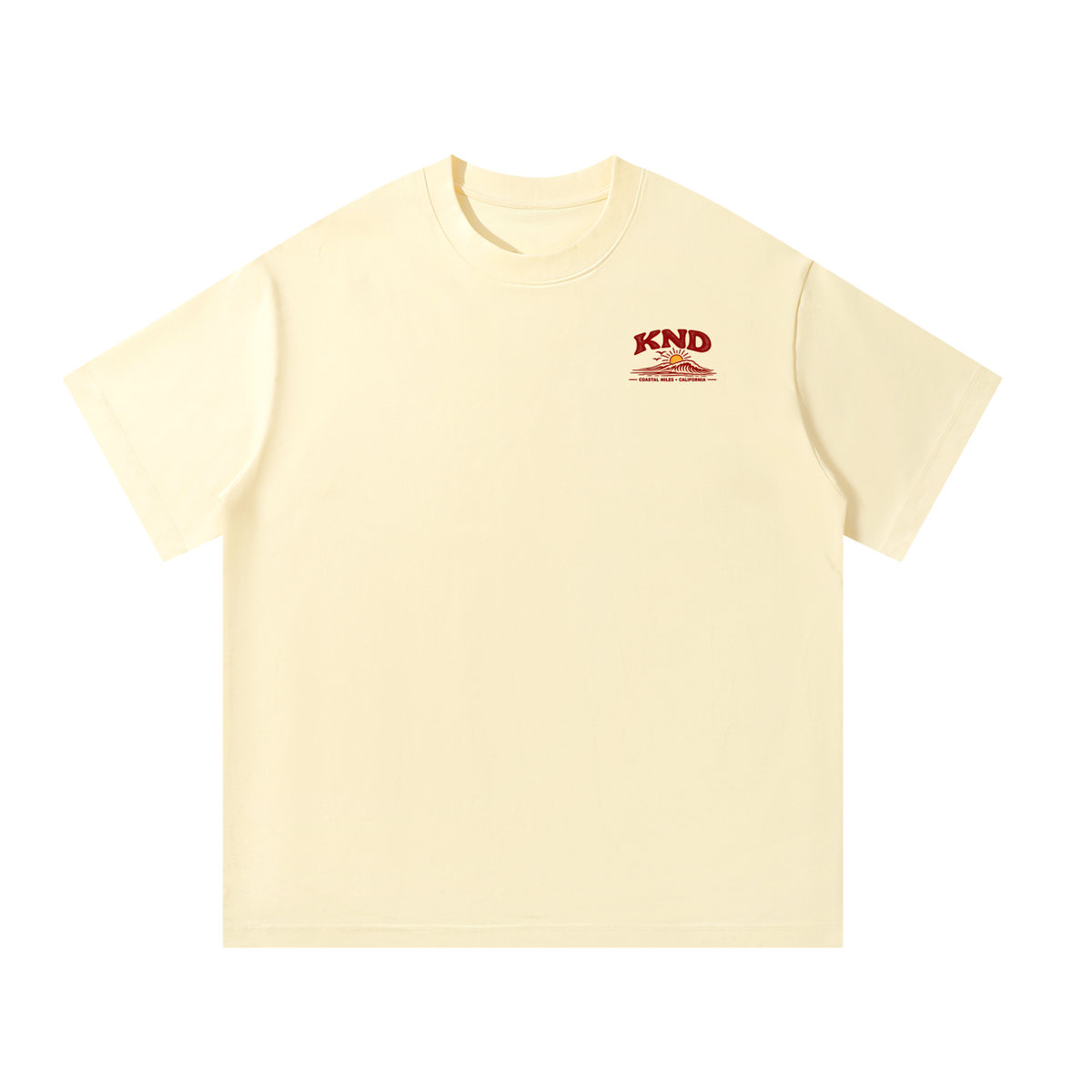 Coastal Miles Tee, Apricot — front view with the small KND sun-and-wave mark on the left chest