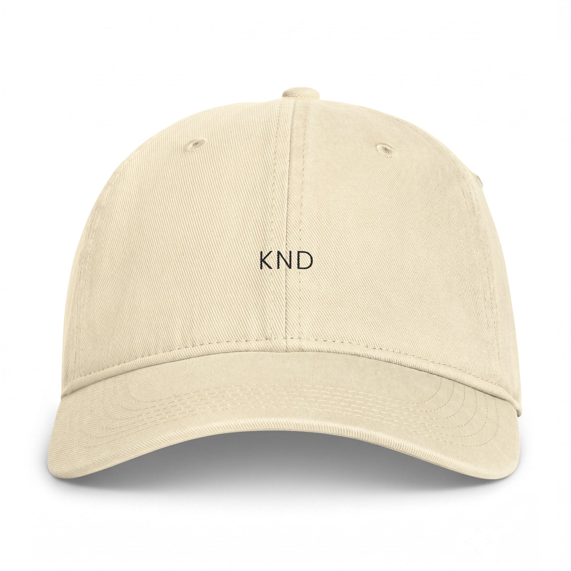 KND Ivory Wordmark Cap — angled view, curved bill