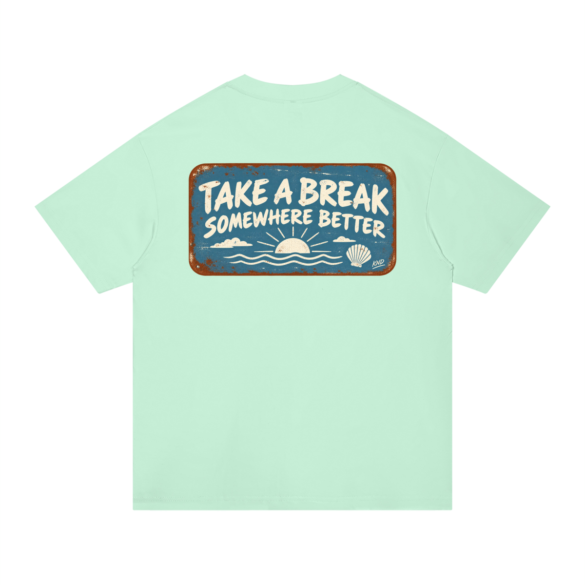 Take a Break Tee, Mint Green — back print, rust-edged enamel sign reading Take a Break Somewhere Better over a sunset and a scallop shell