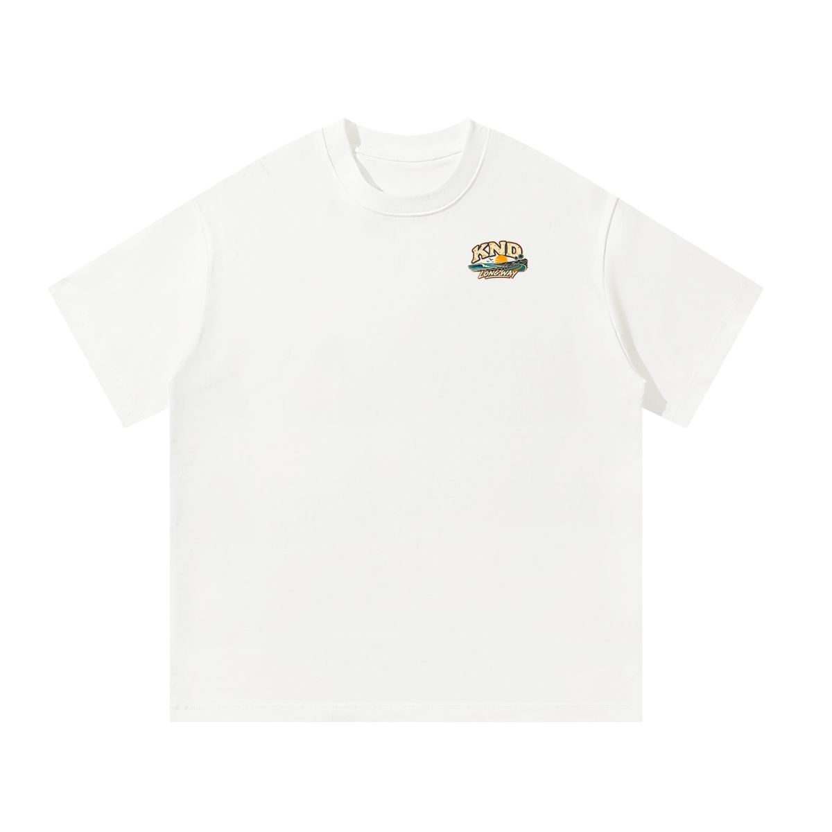 Take the Long Way Tee, White — front view with the small KND coast-road-and-sunset mark on the left chest