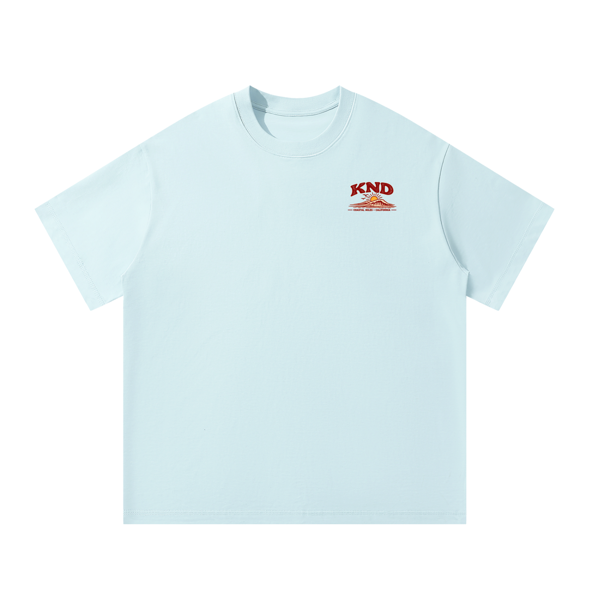 Coastal Miles Tee, Sky Blue — front view with the small KND sun-and-wave mark on the left chest
