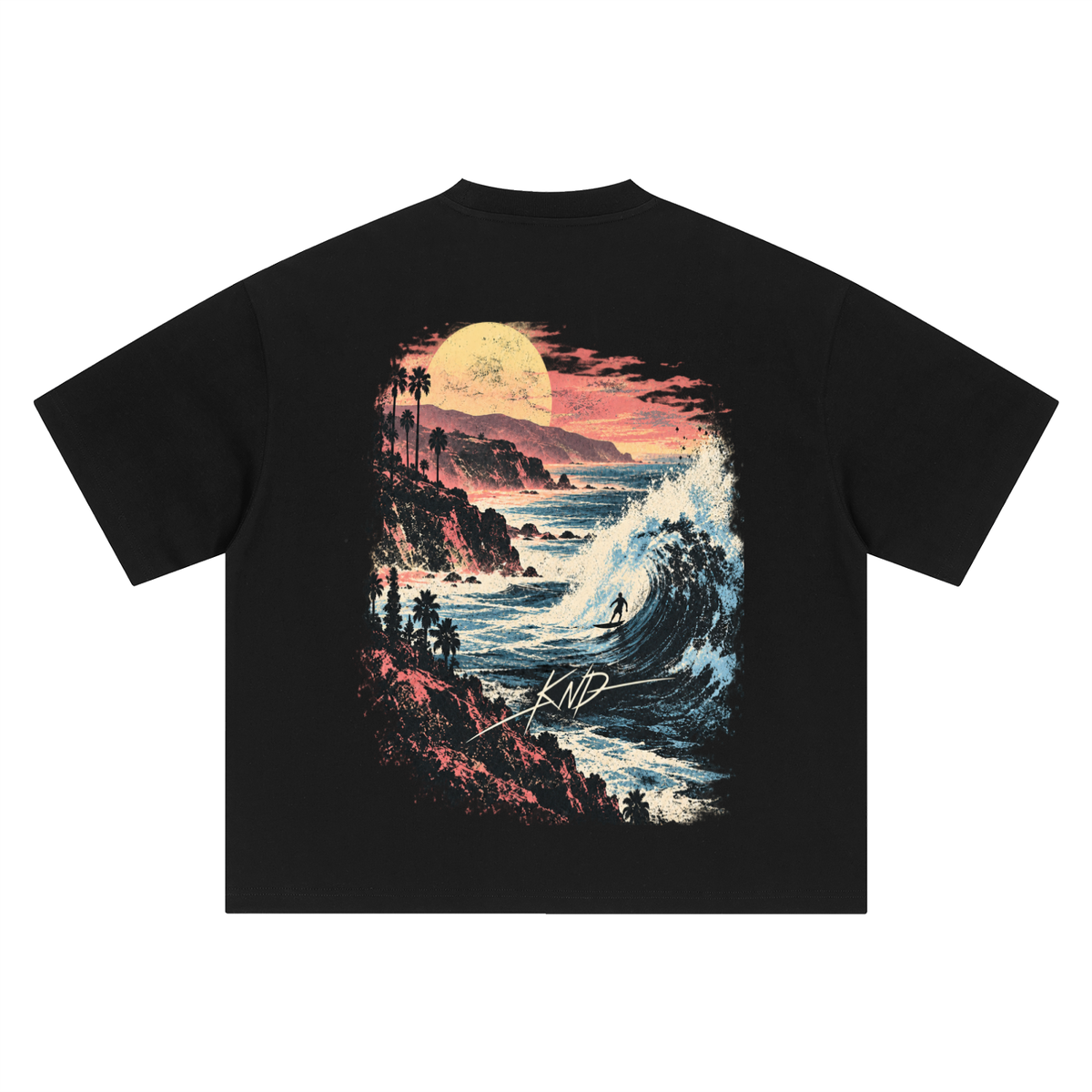 Moonlit Cliffs Tee, Black — back print, palm-lined sea cliffs under a full moon with a breaking wave and a lone surfer