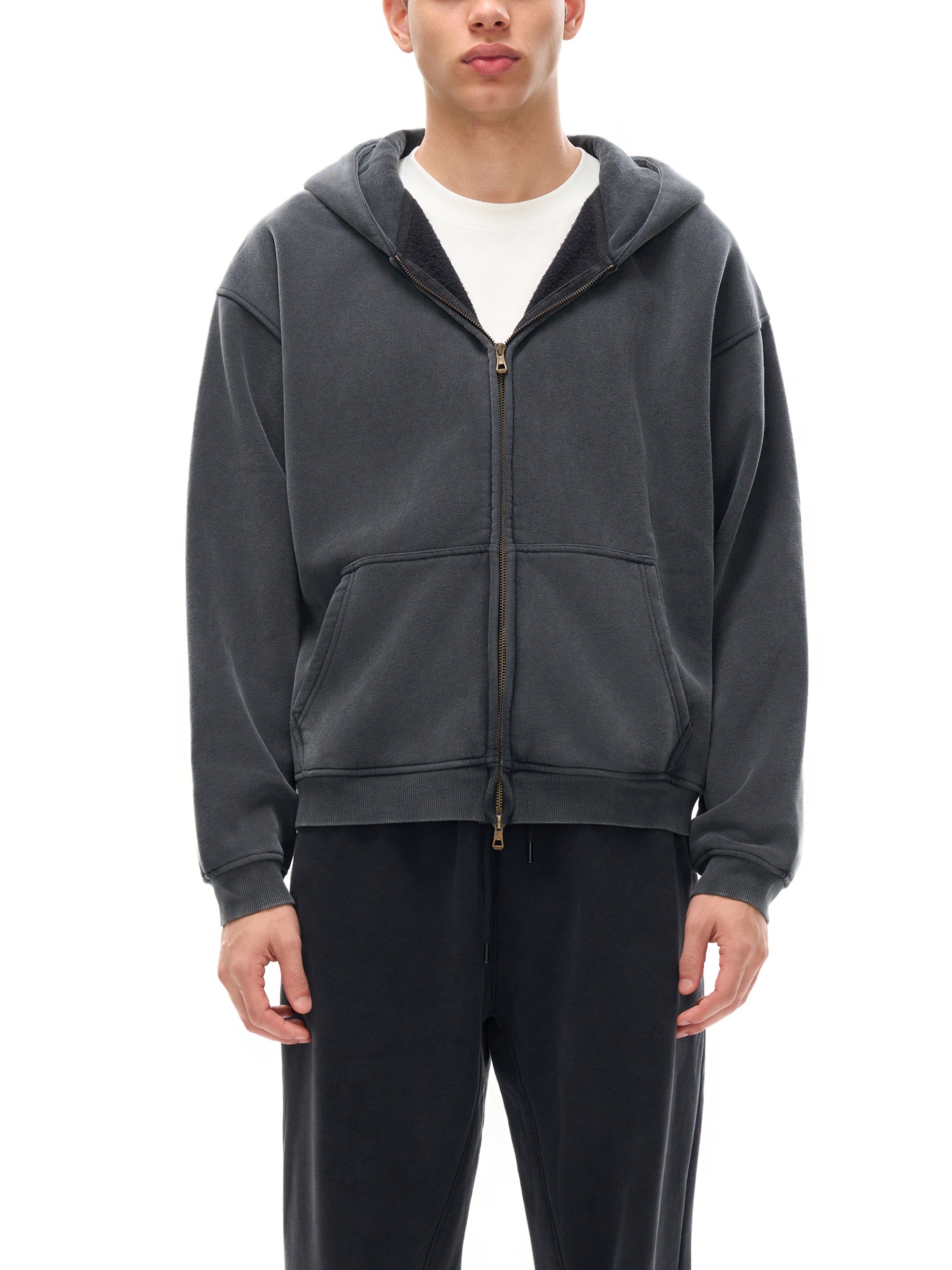 Detail of the garment-washed brushed fleece texture on the KND Brand zip hoodie