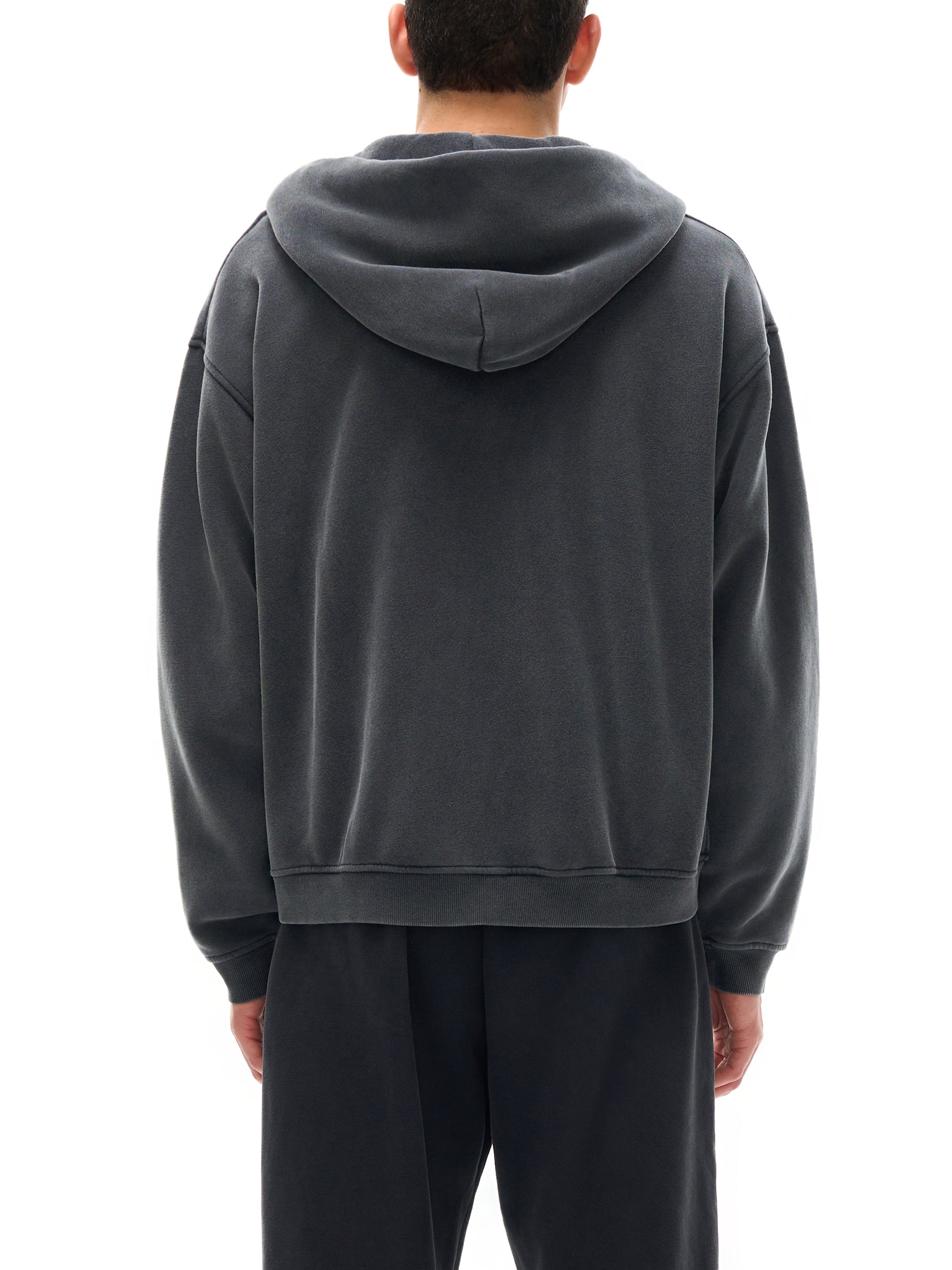 Detail of the split kangaroo pocket on the KND Brand zip-through hoodie