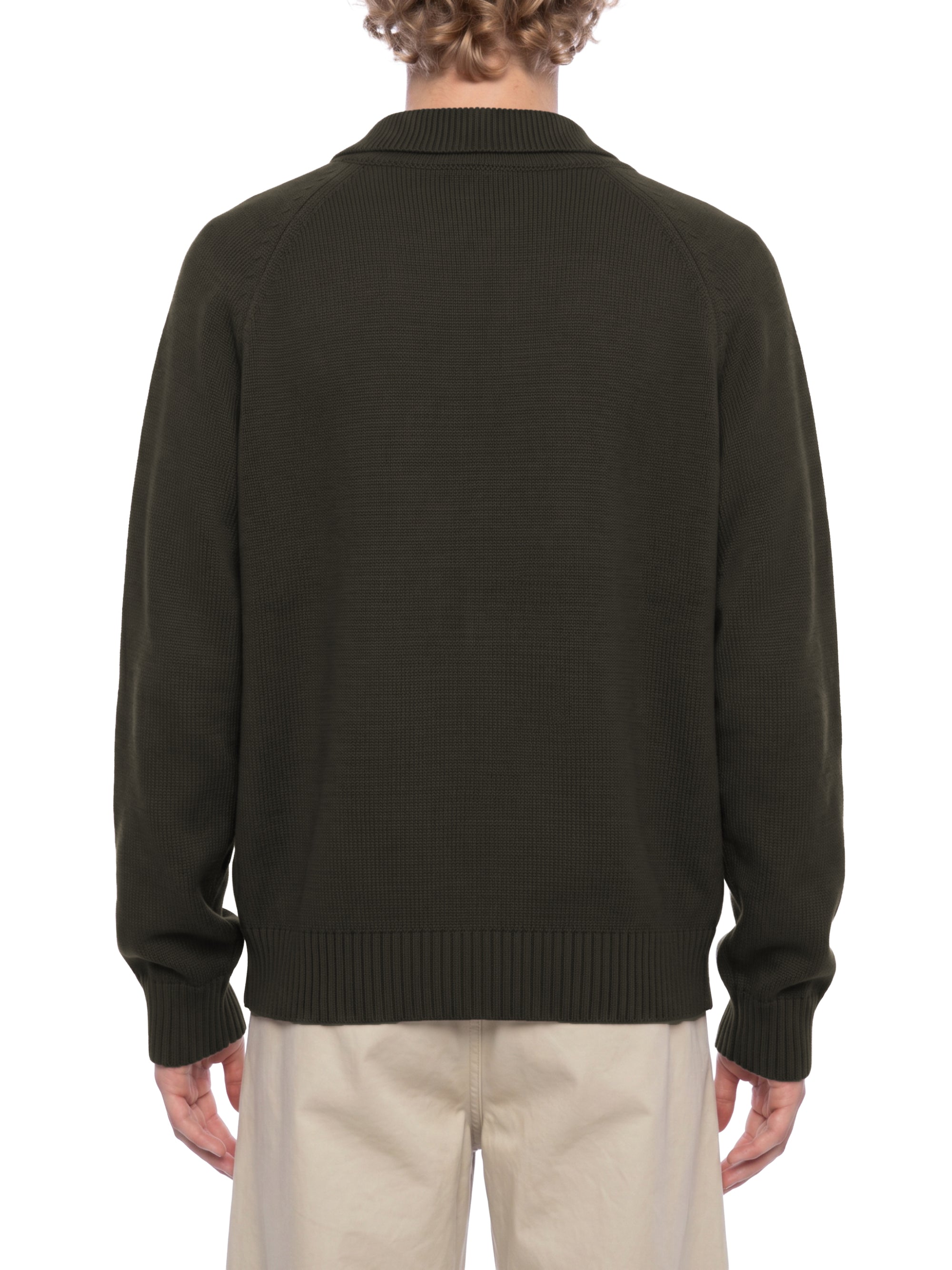 Male model wearing the KND Brand quarter-zip sweater with the collar zipped