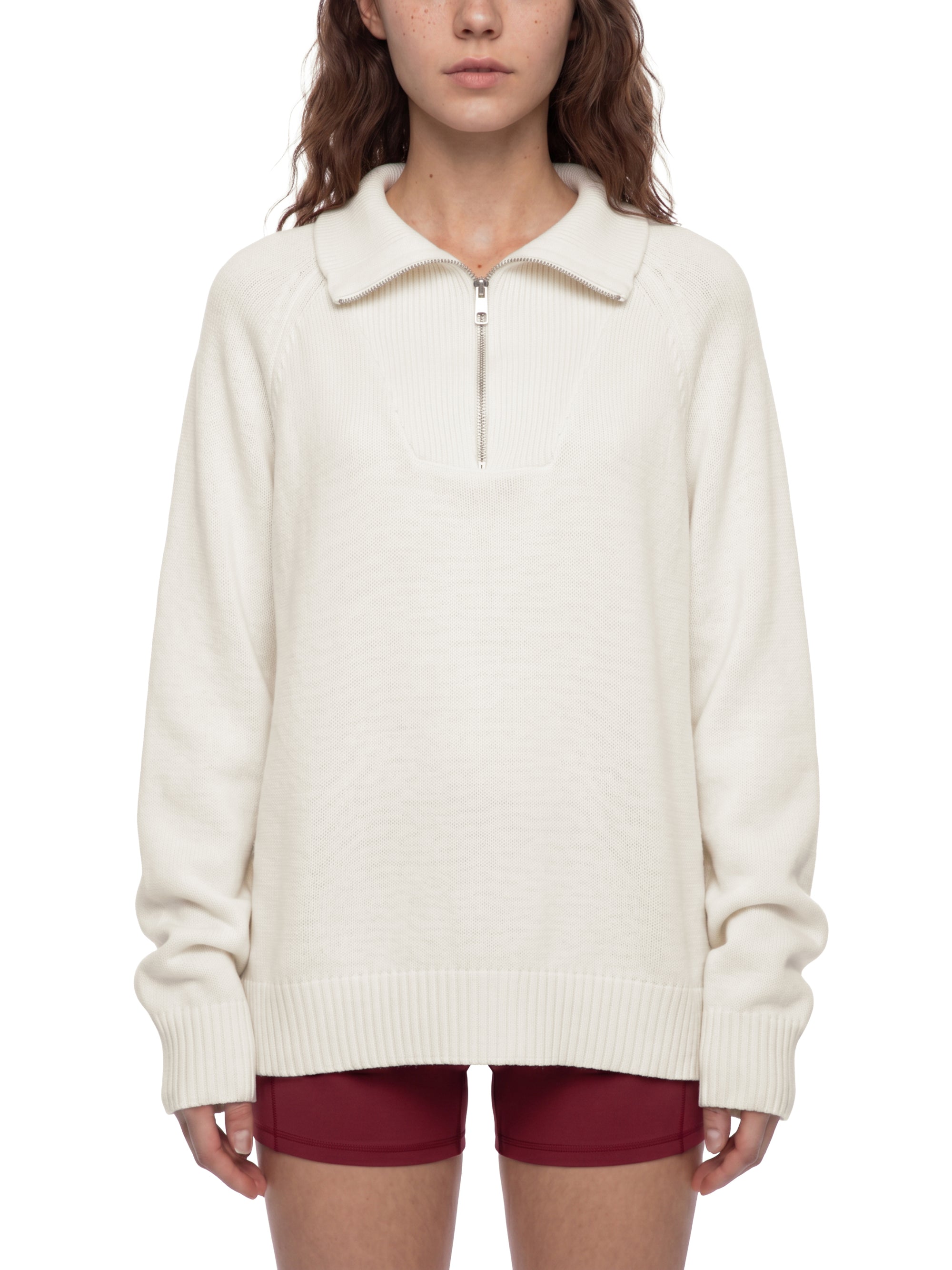 Female model 5 foot 8 wearing the KND Brand heavyweight quarter-zip sweater in size S, front