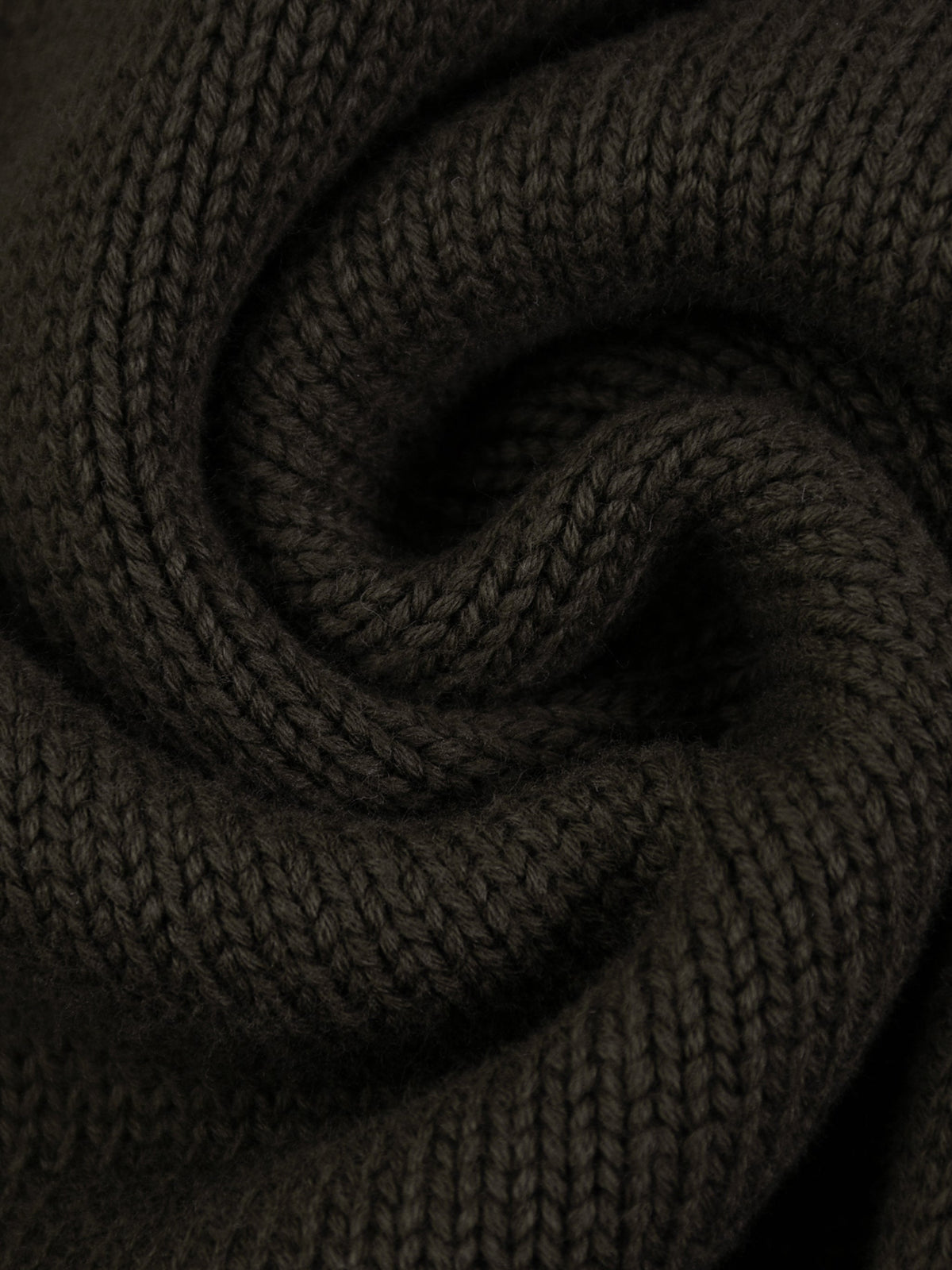 Close-up of the woven KND neck label inside the heavyweight quarter-zip sweater