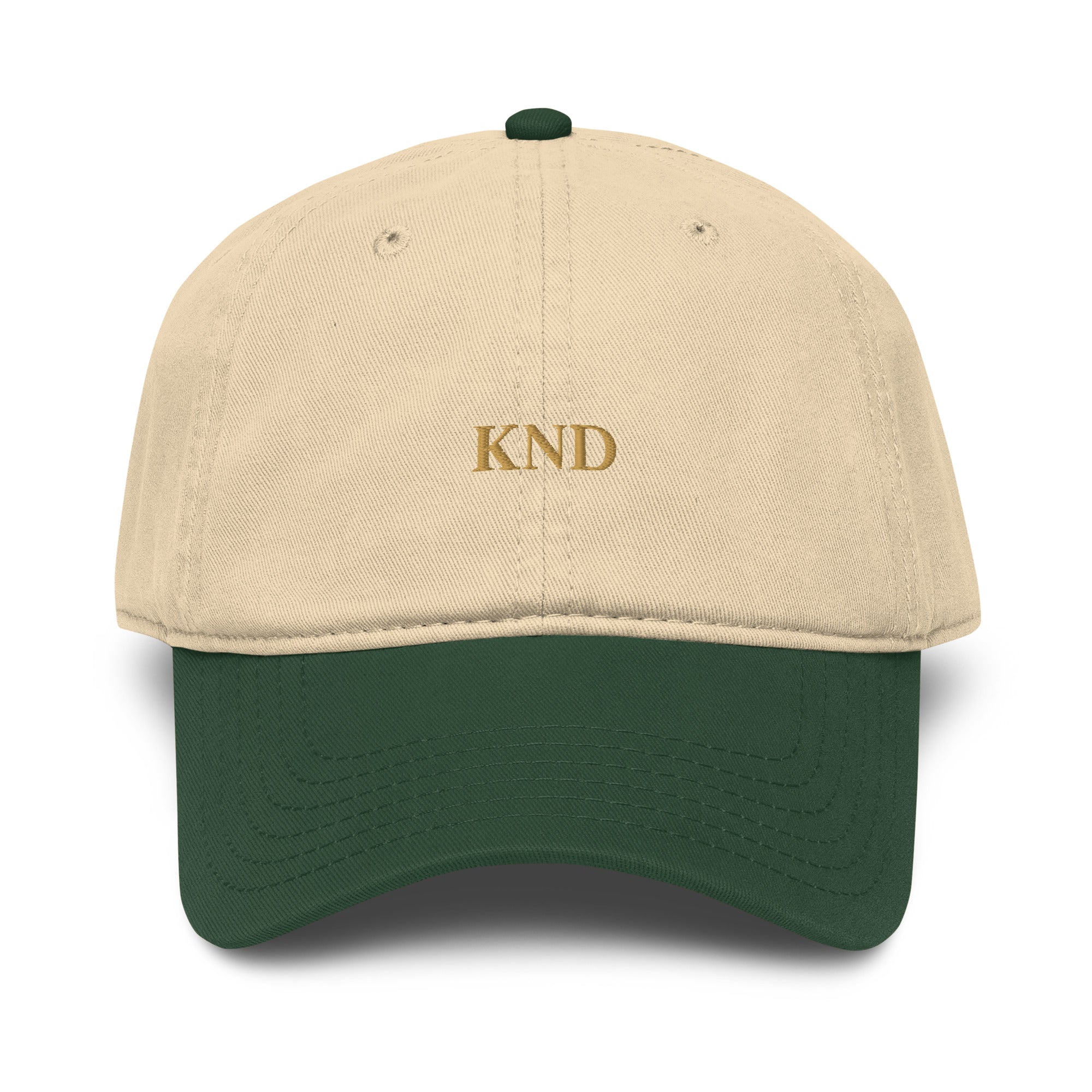 KND Wordmark Cap in dark green with khaki visor — six-panel garment-washed cotton cap, front view