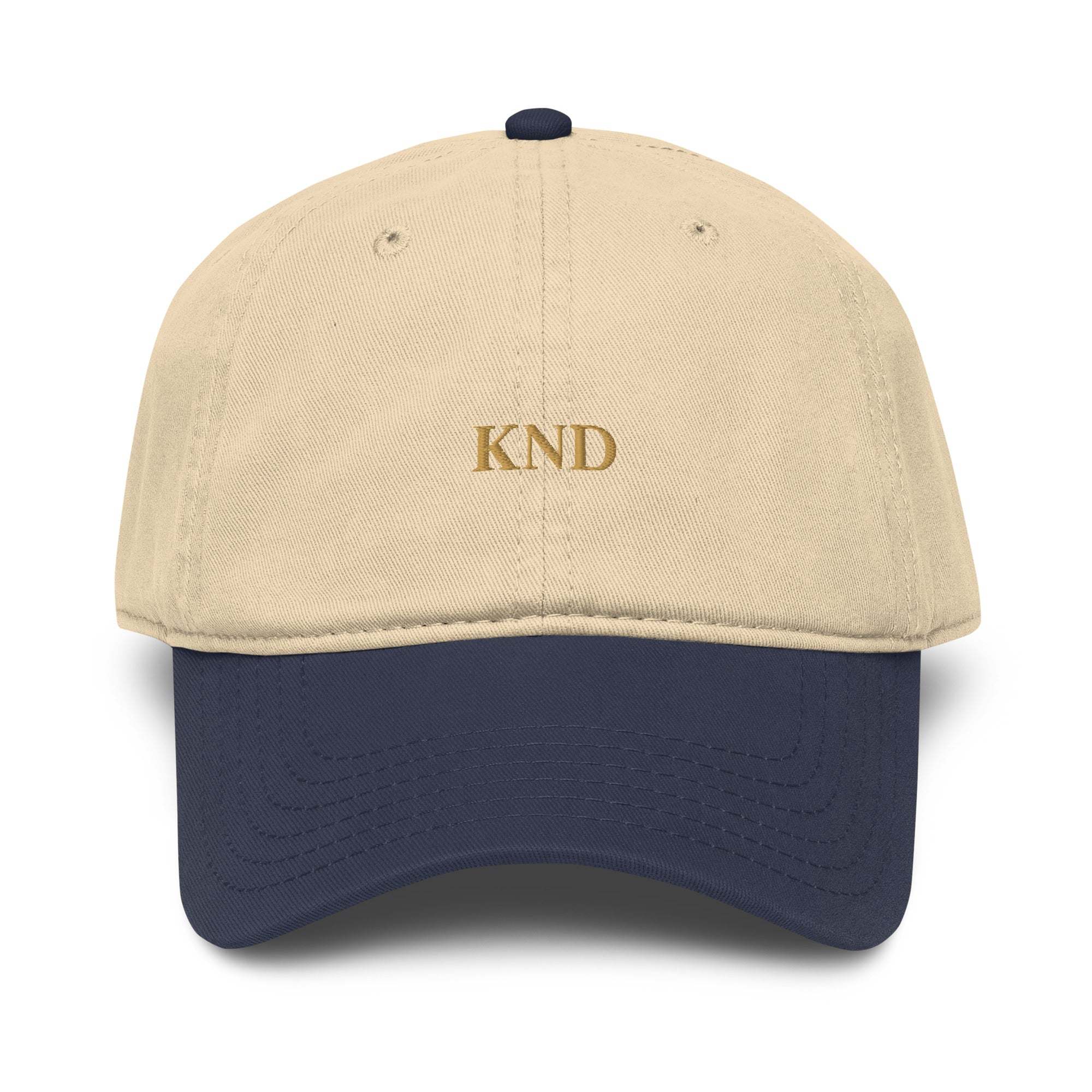 KND Wordmark Cap in navy with khaki visor — six-panel garment-washed cotton cap, front view